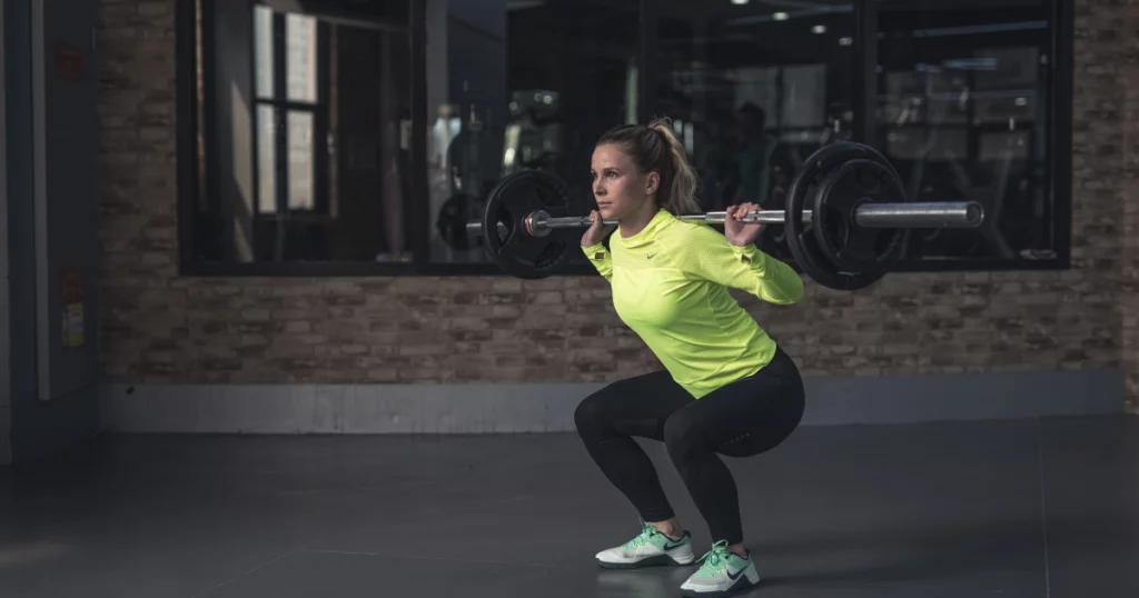 Woman squatting with a barbell 